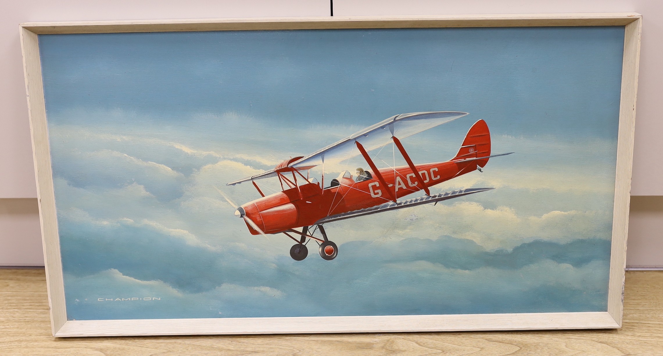 Peter Champion, oil on board, Bi-plane in flight, signed, 40 x 75cm